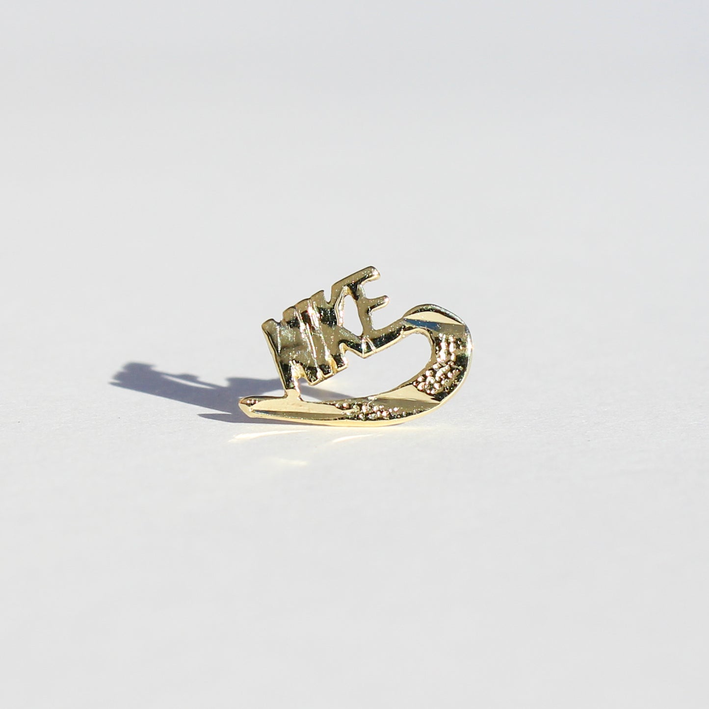 Nike VTG 10kt gold stud earring
