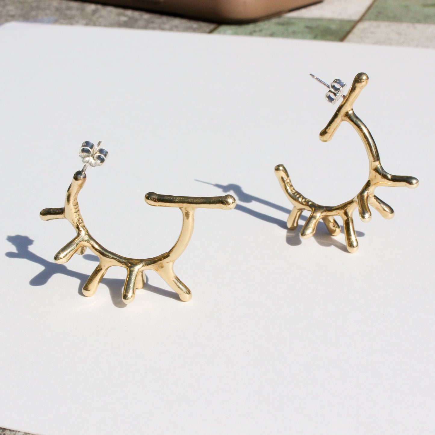melty spike hoop earrings