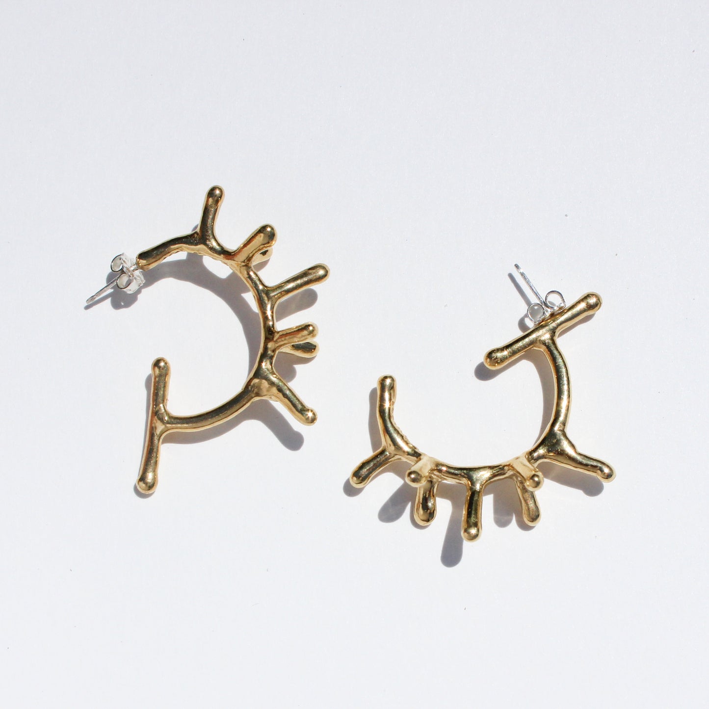melty spike hoop earrings